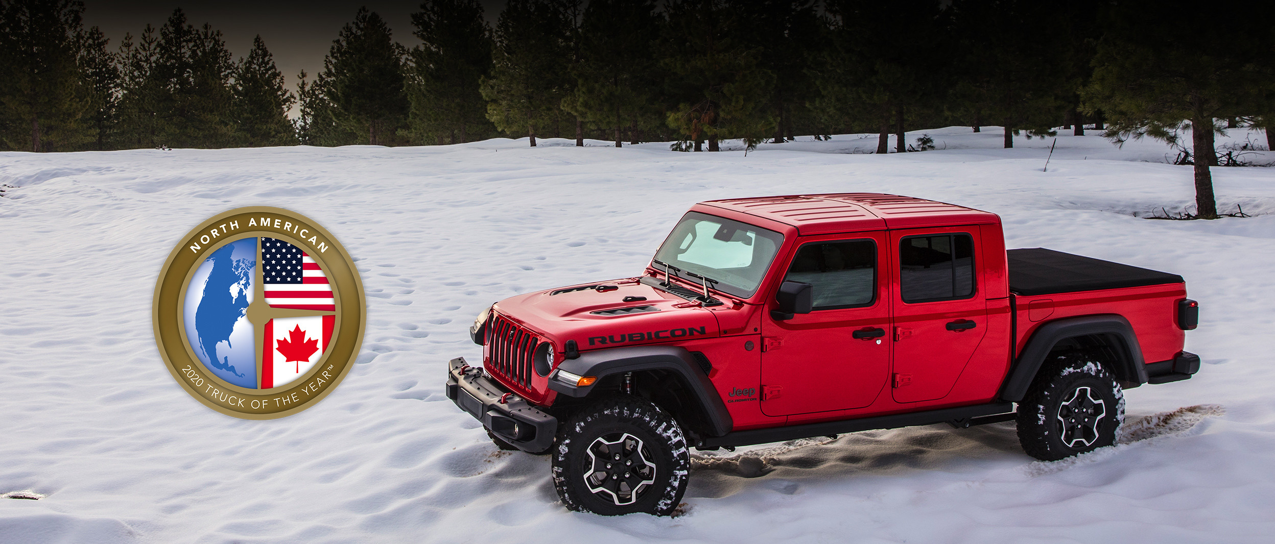 Top-down view of the all-new 2020 Jeep Gladiator in red parked in a snow covered field with NACTOY award logo.