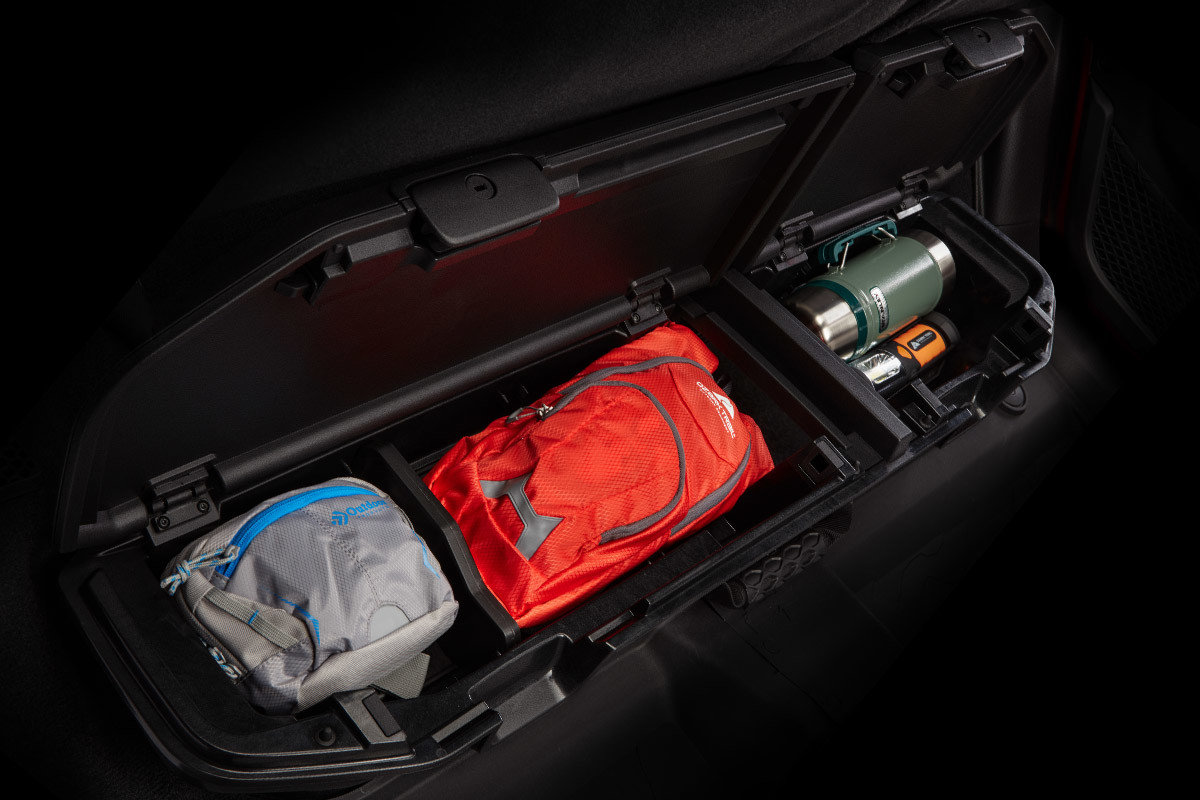 Open lockable storage space displaying various belongings securely stored inside.