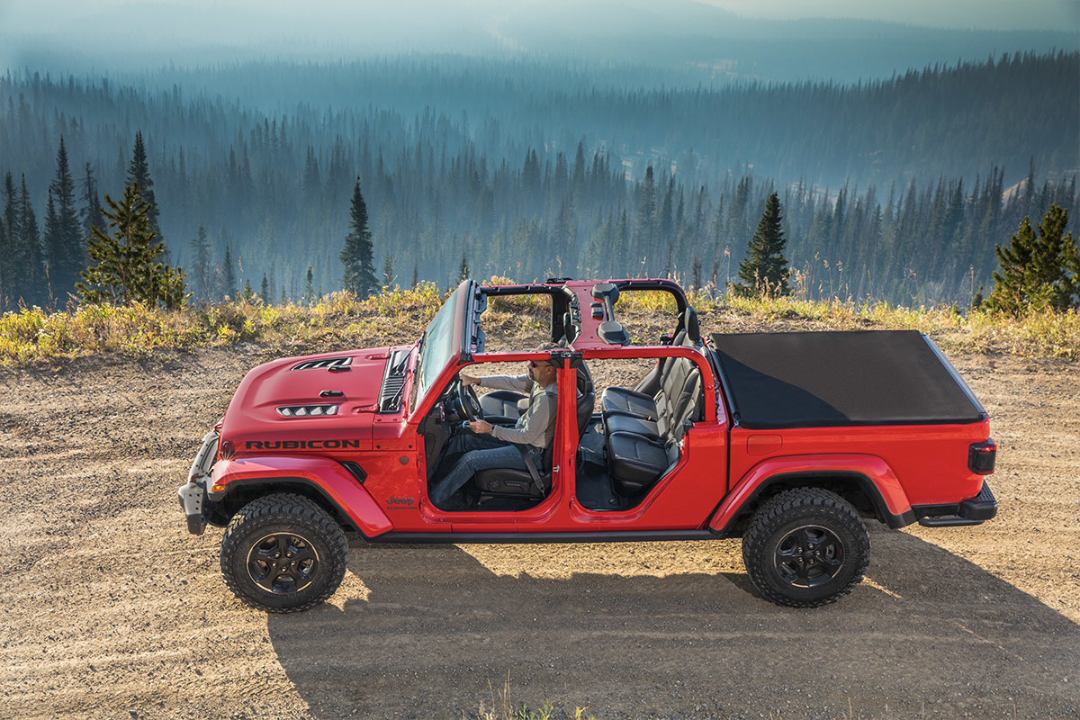 UNMATCHED OPEN-AIR FREEDOM A red 2022 Jeep Gladiator with the top off and doors off.