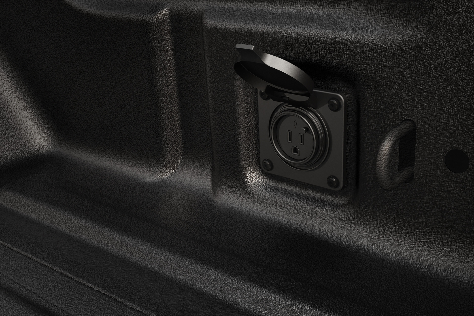 Close up of the 115 volt power outlet inside the 2022 Jeep Gladiator.