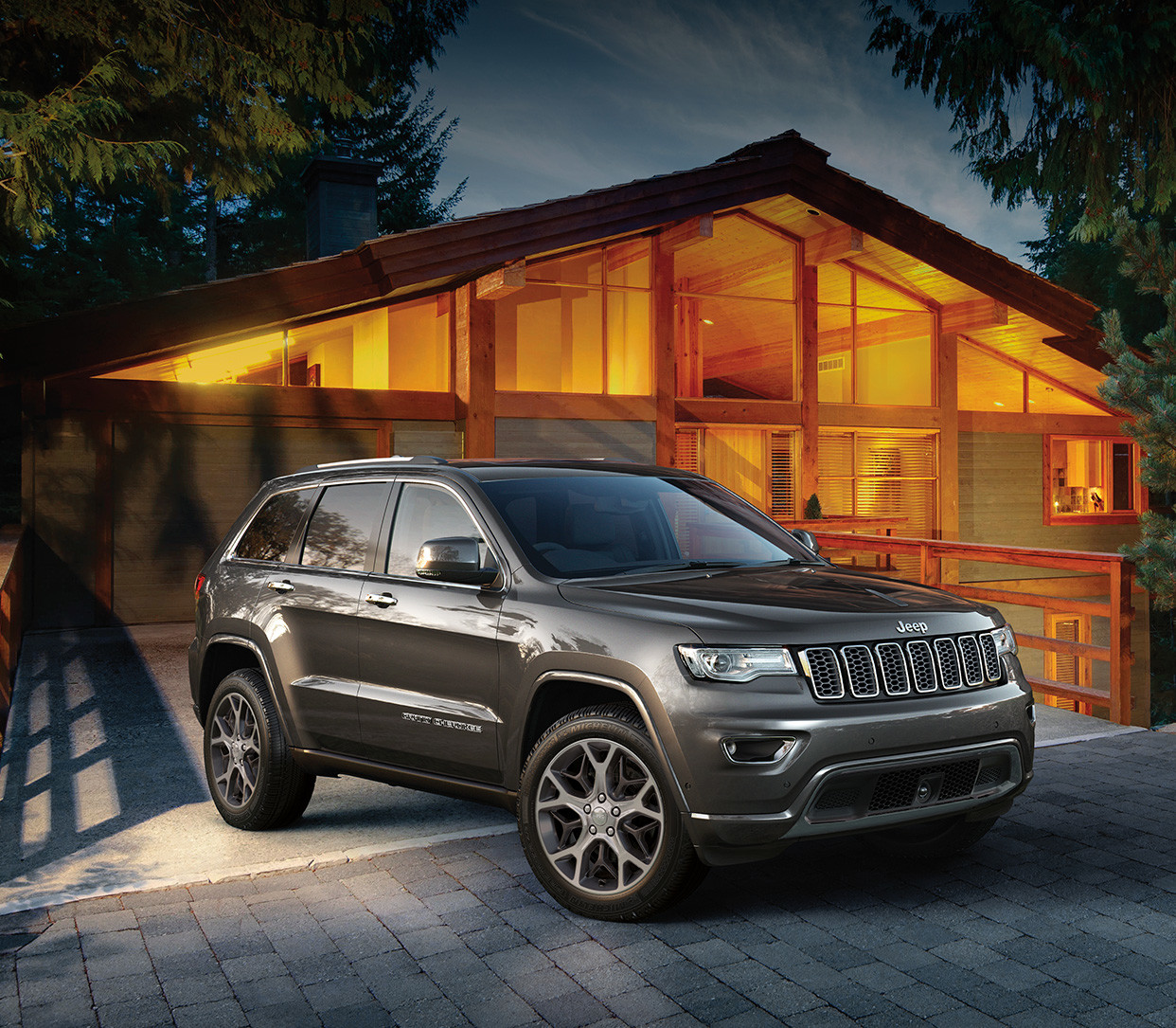 Black 2019 Jeep Grand Cherokee Speeding Through the Roads in Front of a City Skyline