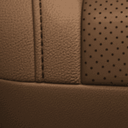 Natura Plus leather with perforated inserts – Tan with Tan embroidered Summit<sup>®</sup> logo, and Black accent stitching and piping