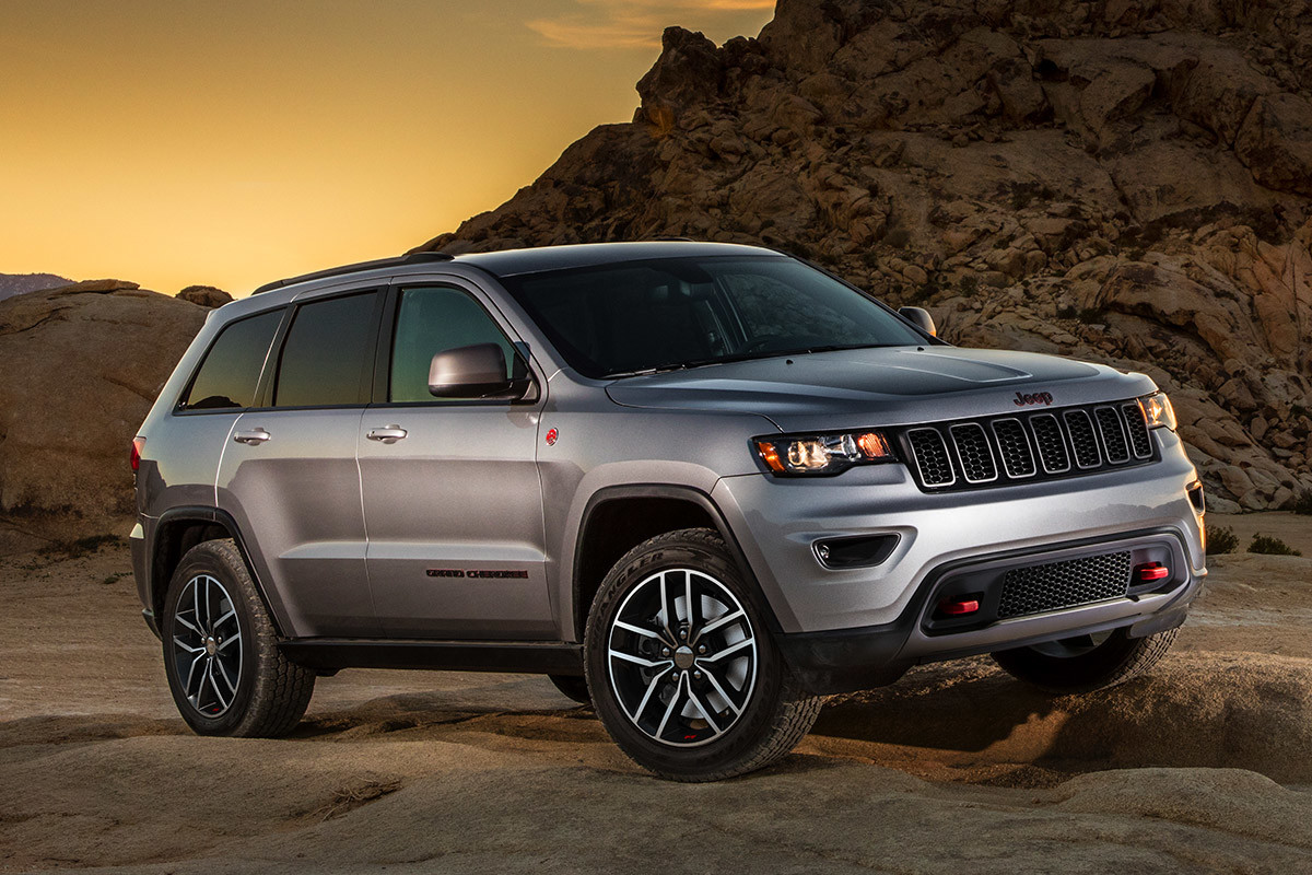 Silver 2020 Jeep Grand Cherokee parked in a desert.