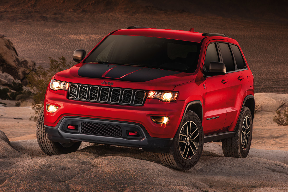 Red 2020 Jeep Grand Cherokee Trailhawk parked in a desert.