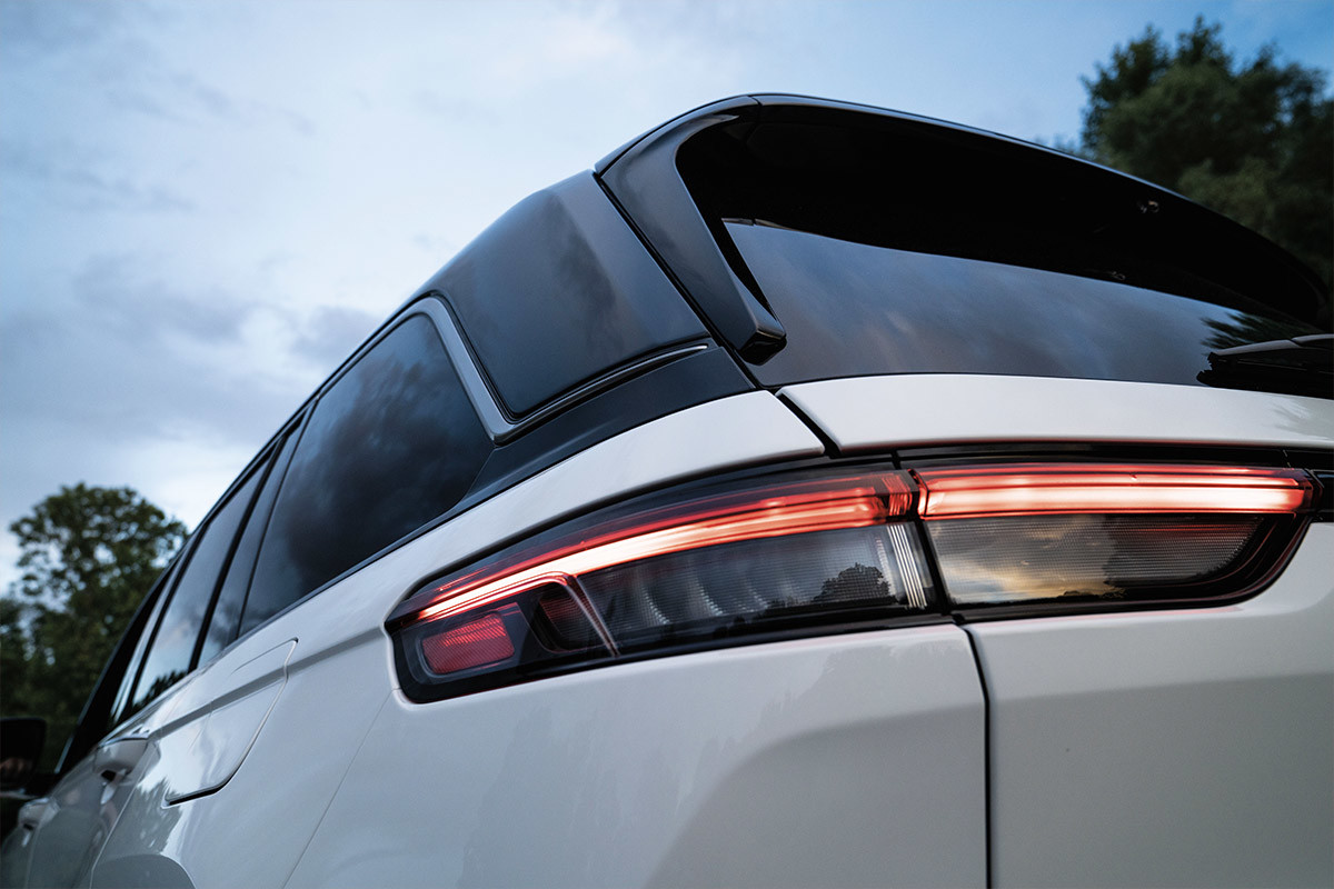 A close-up view of the tail-lamp on a white All-New 2022 Jeep Grand Cherokee 4xe.