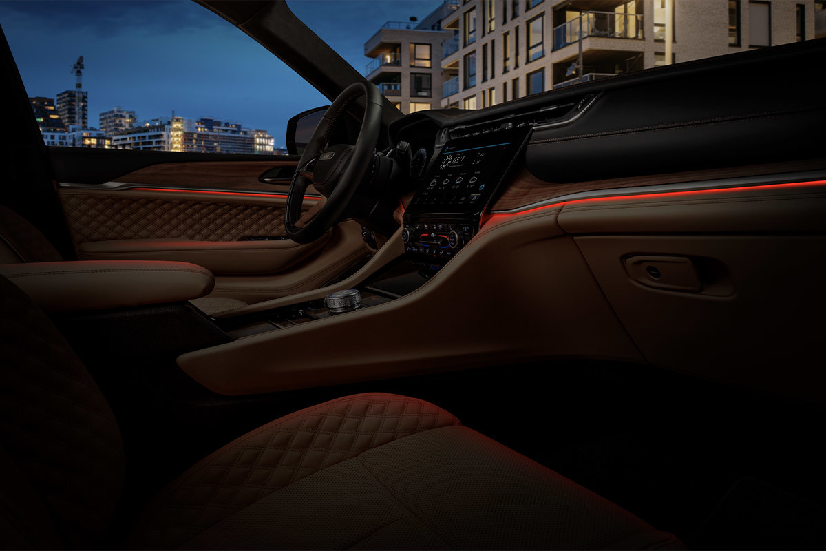 Interior view of the ambient LED lighting in the front row of the All-New 2022 Jeep Grand Cherokee 4xe.