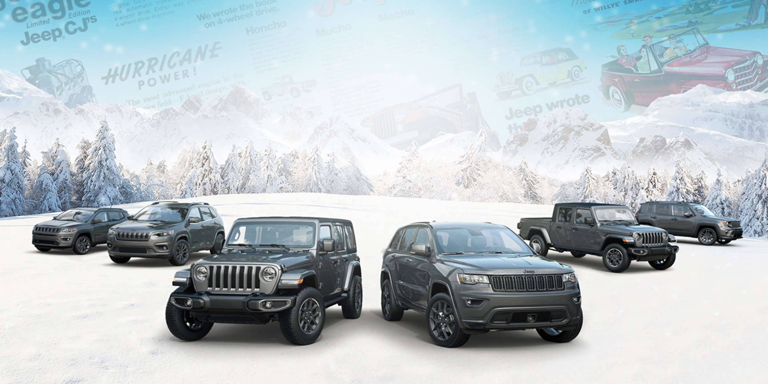 Full grey Jeep line up in the snow, with trees and mountains in the background.