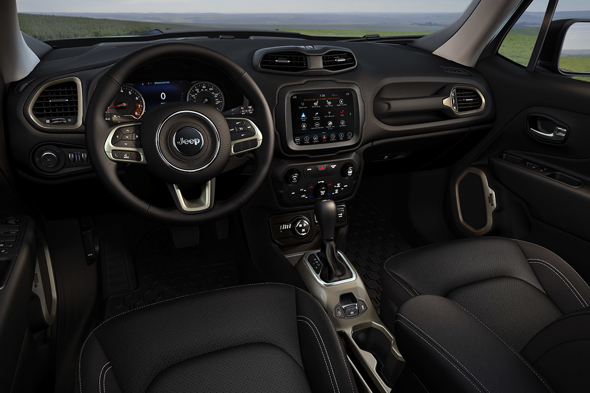 Zoomed out view of 2020 Jeep Renegade front cabin showing steering wheel and centre console