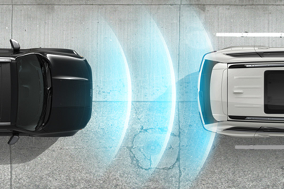 Bird eye view of 2020 Jeep Renegade being driven on a road highlighting forward collision warning system