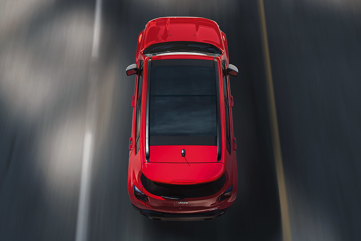 Bird eye view of red 2020 Jeep Renegade on a road