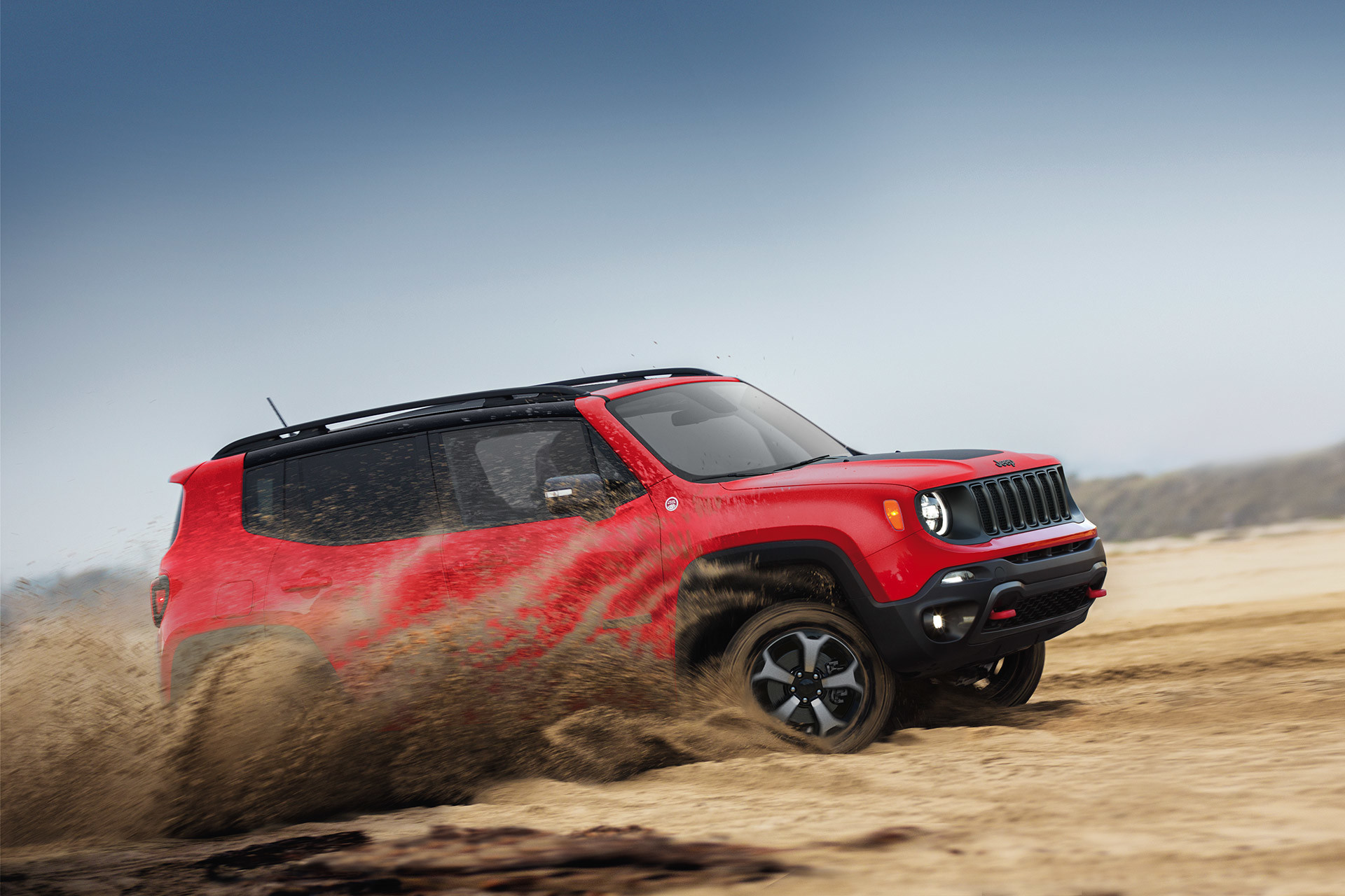 Side view of 2020 Jeep Renegade being driven in a dessert