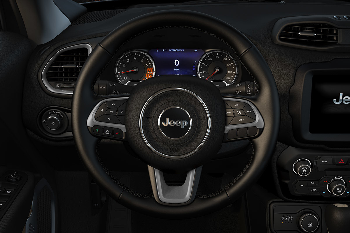 Vue intérieure de la cabine du Jeep® Renegade portant l’accent sur le volant, selon la perspective du conducteur.