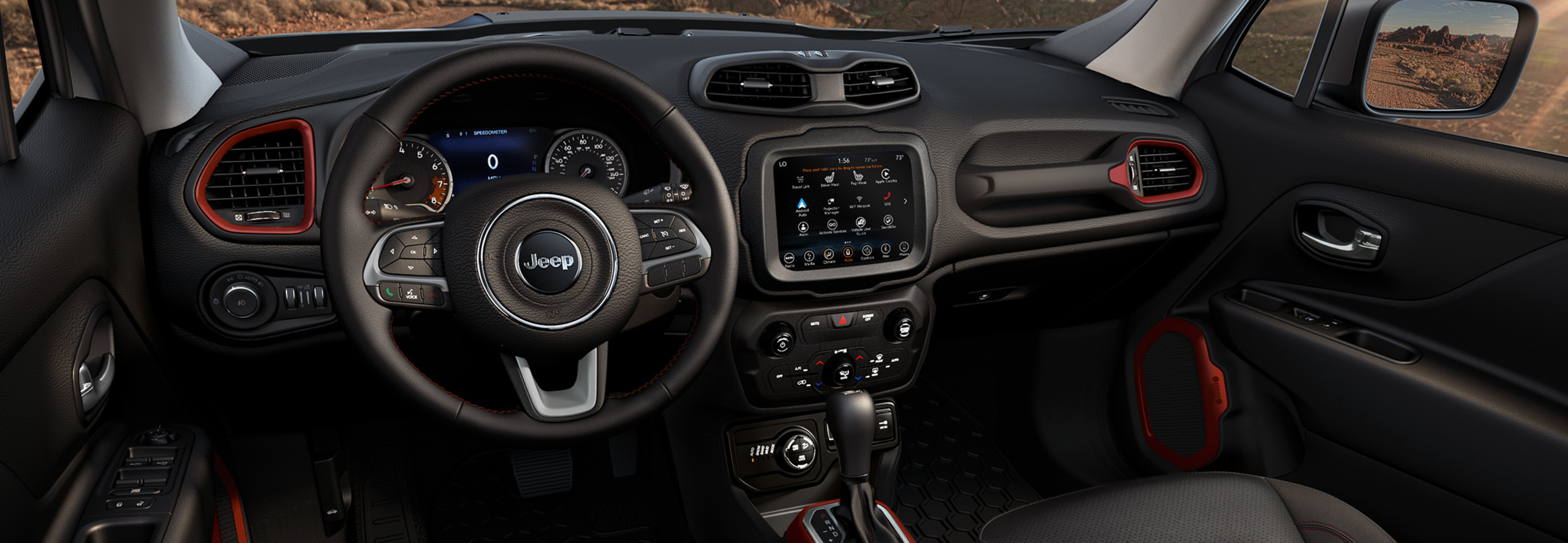Avant de l’habitacle d’un Jeep Renegade 2022 avec fini noir et rouge.