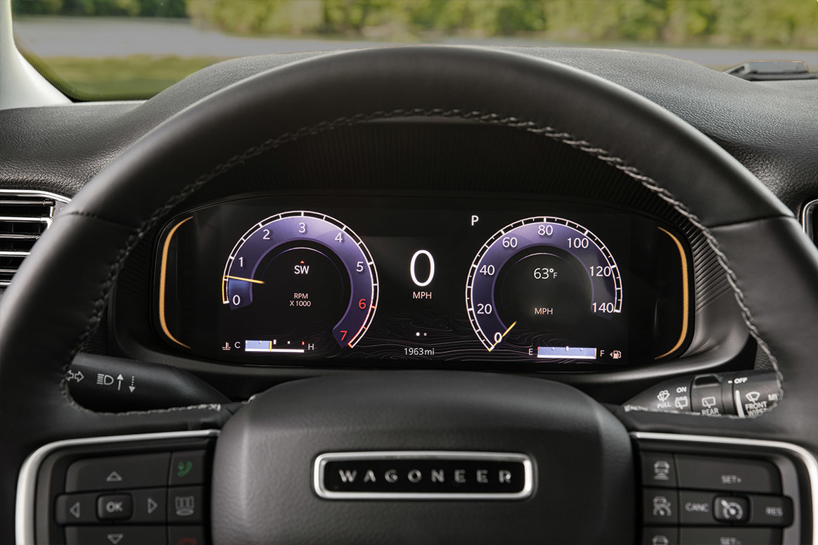 View of a steering wheel and instrument cluster with 10.25-inch display.