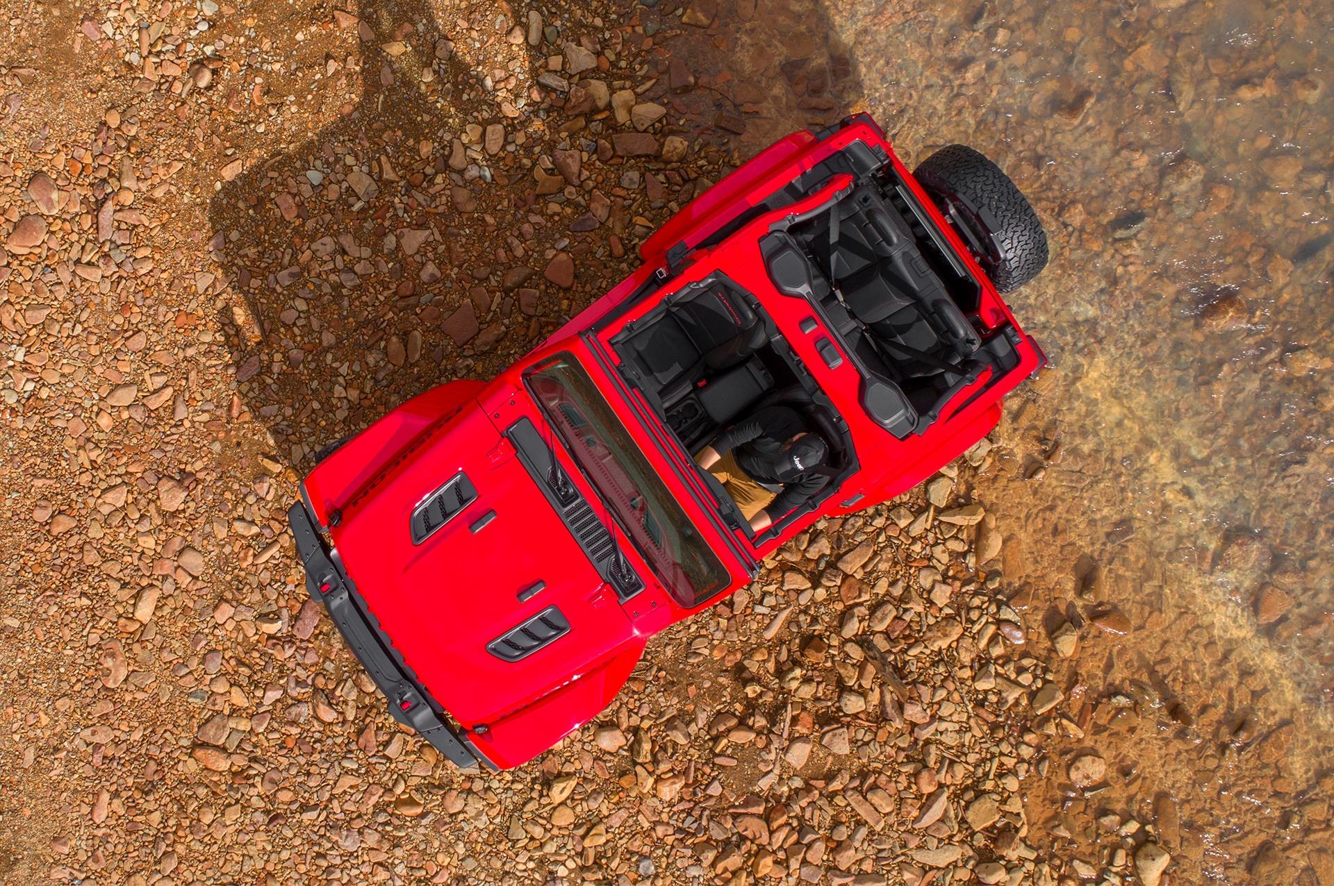2018 Jeep Wrangler JL, shown in red available in either hardtop to soft top or power convertible top