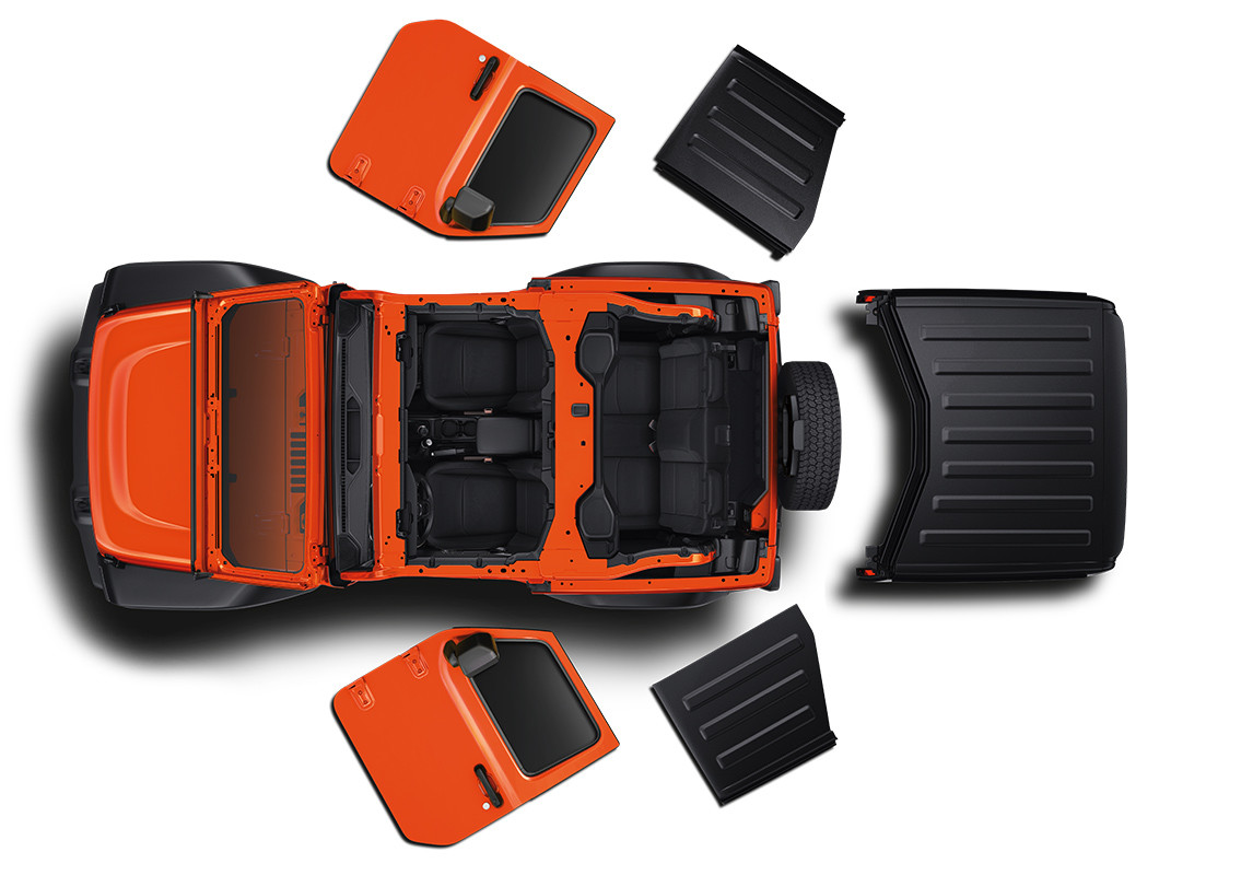 Vue latérale du Jeep Wrangler 2019 en montagne, illustré en rouge