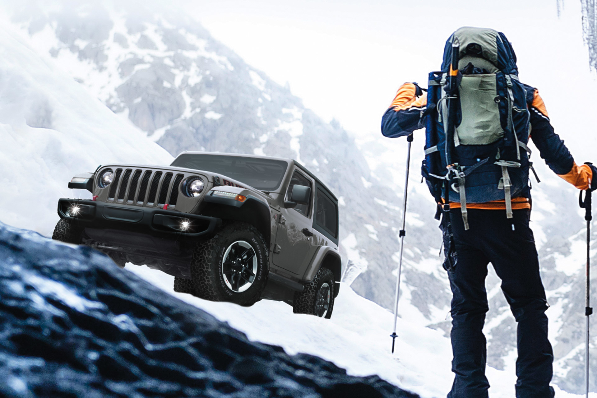 Wide angle view of a hiker walking in front of a Jeep Wrangler in grey