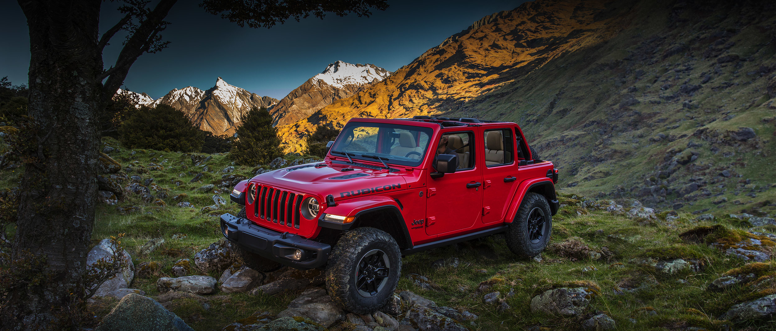 The 2020 Jeep<sub>®</sub> Wrangler parked outdoors on a mountain