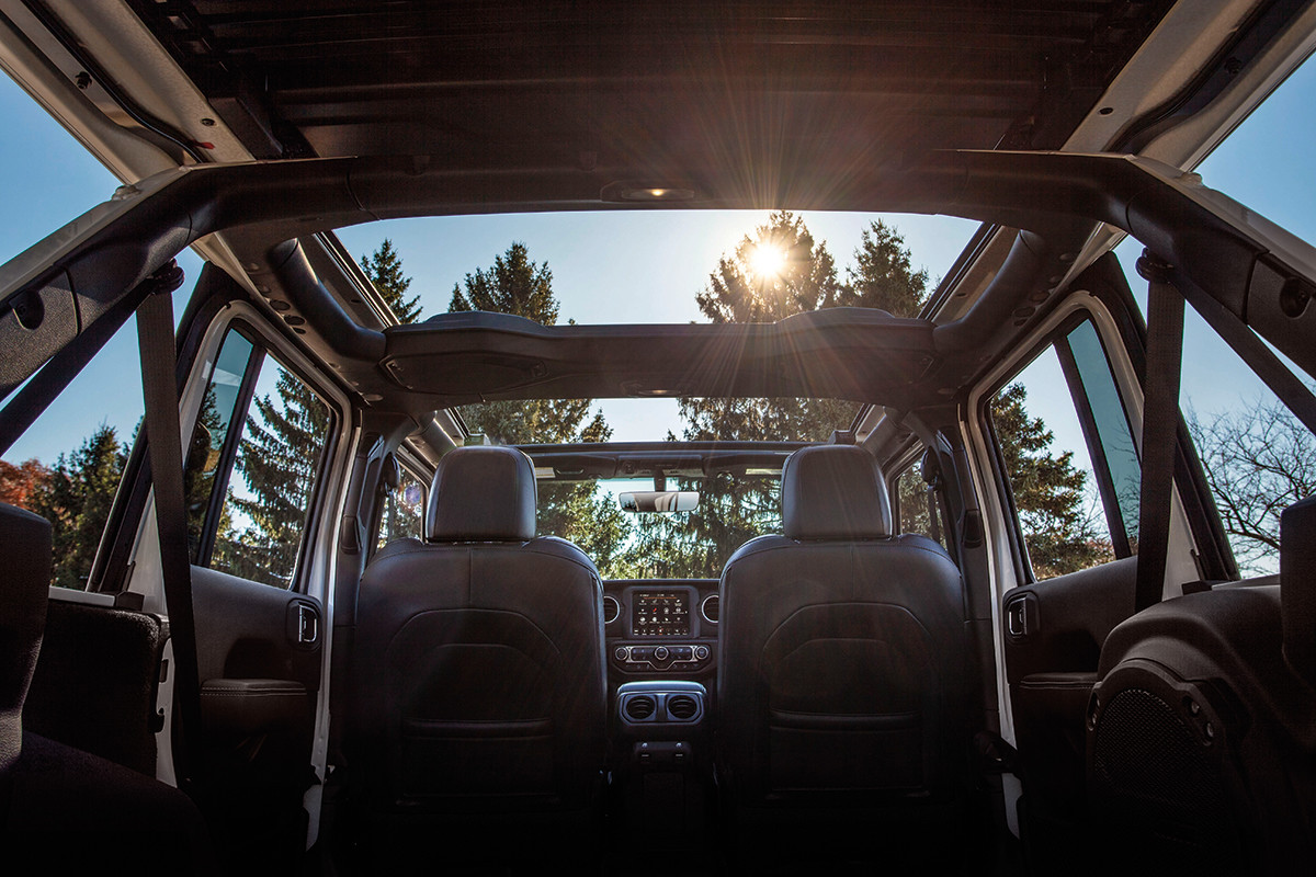 Interior view of backseat of Jeep Wrangler with open sunroof.