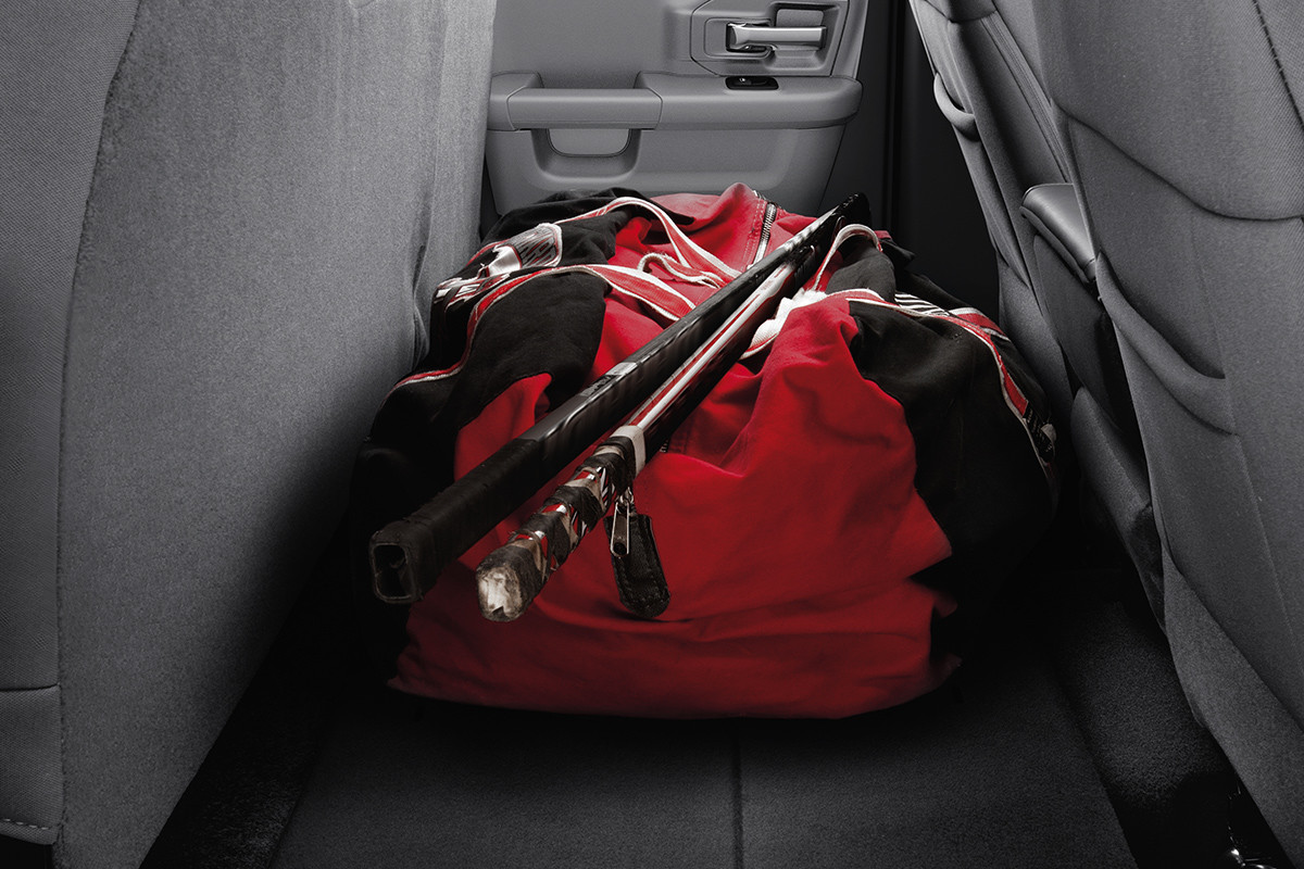 A red hockey bag behind the front seats in the 2020 Ram 1500 Classic