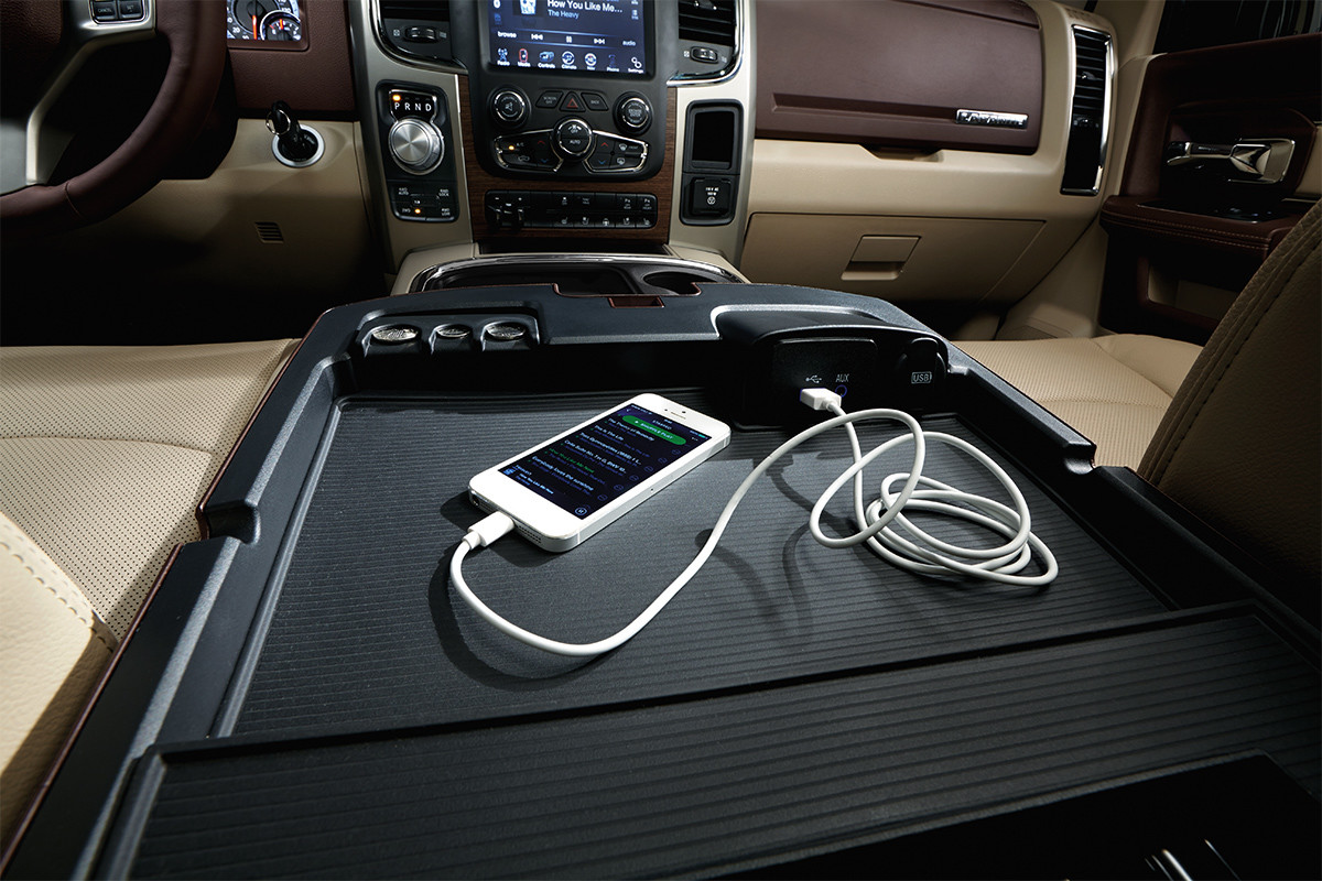 Close up view of a phone plugged into the media hub inside the 2020 Ram 1500 Classic