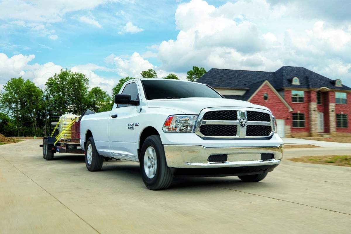 Ram 1500 Classic 2020 white front view towing a trailer