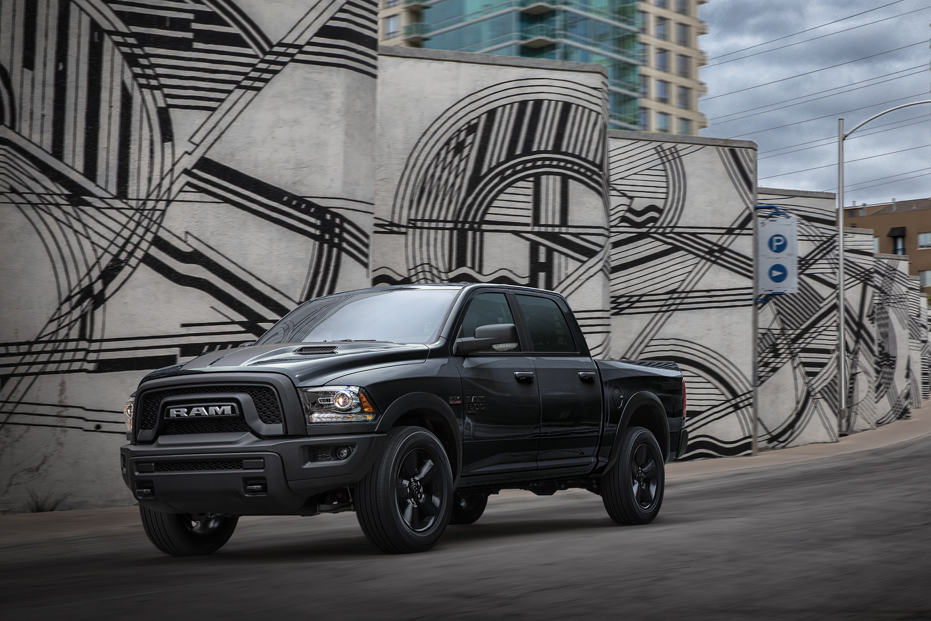 Front view of the black 2020 Ram 1500 Classic Warlock parked in an urban area