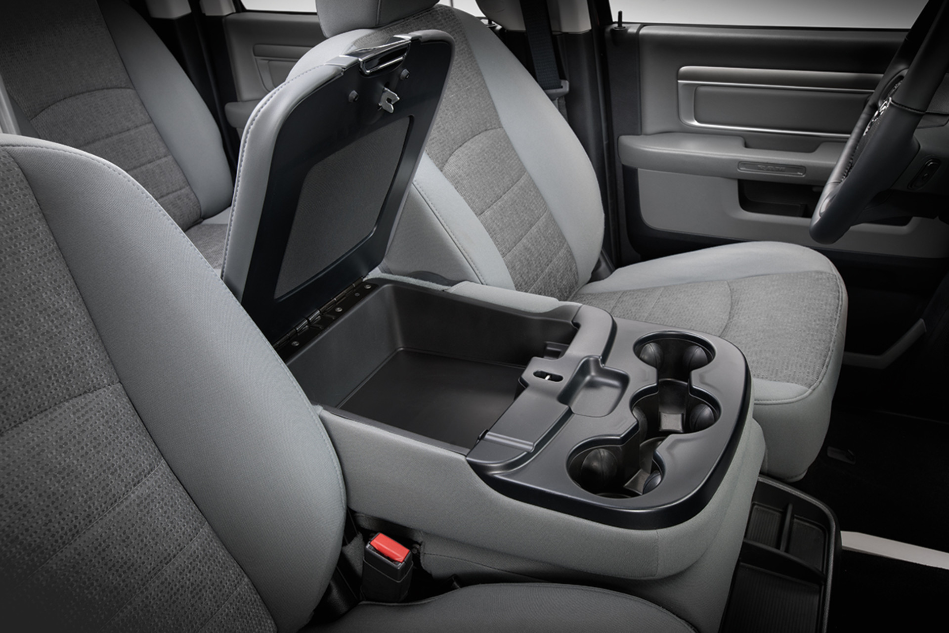 Grey fold-down centre console between the front seats of a 2022 Ram 1500 Classic.