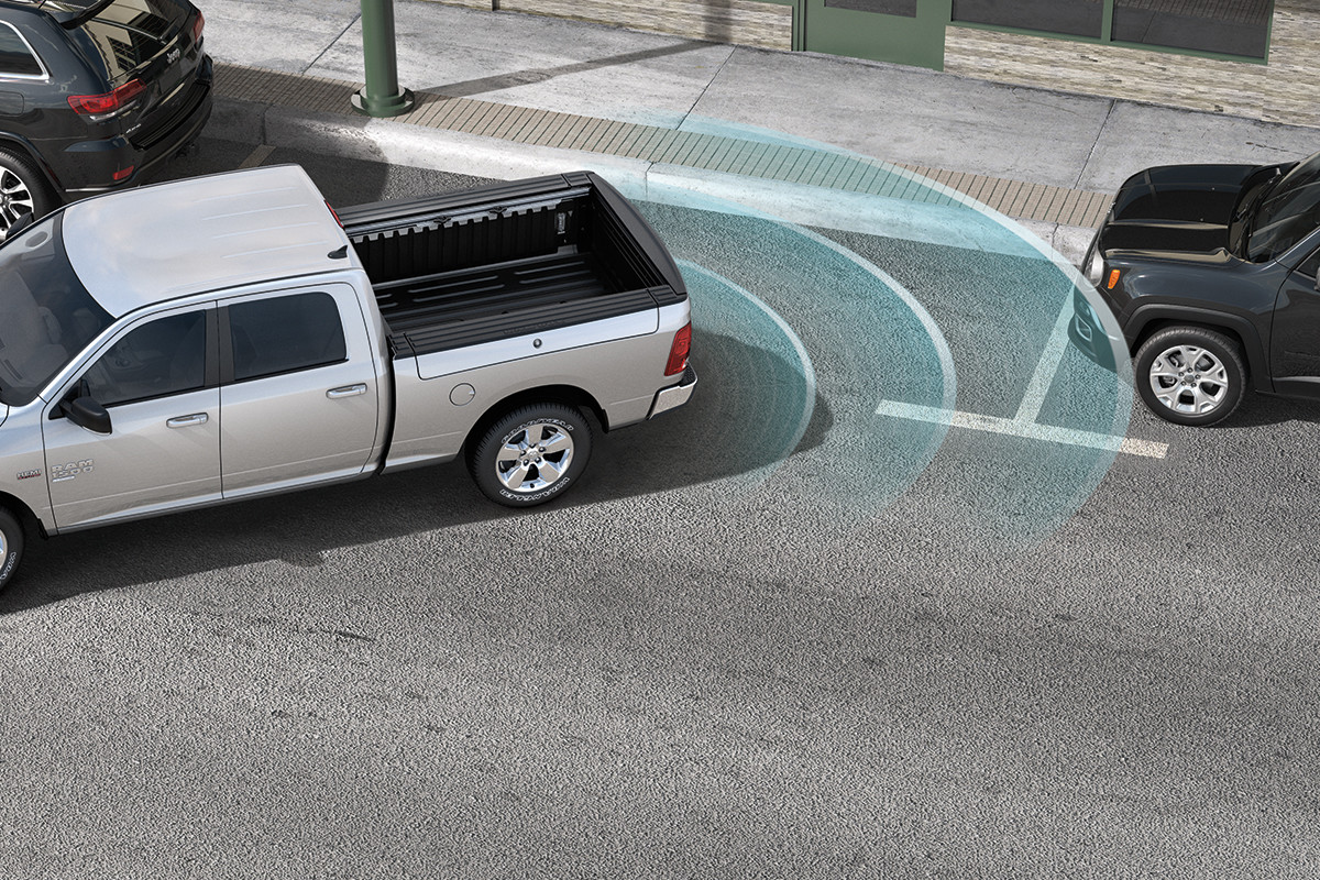 A 2022 Ram 1500 Classic in Bright Silver Metallic with sensors indicating Parallel Park Assist with Park-Sense Front and Rear technology.