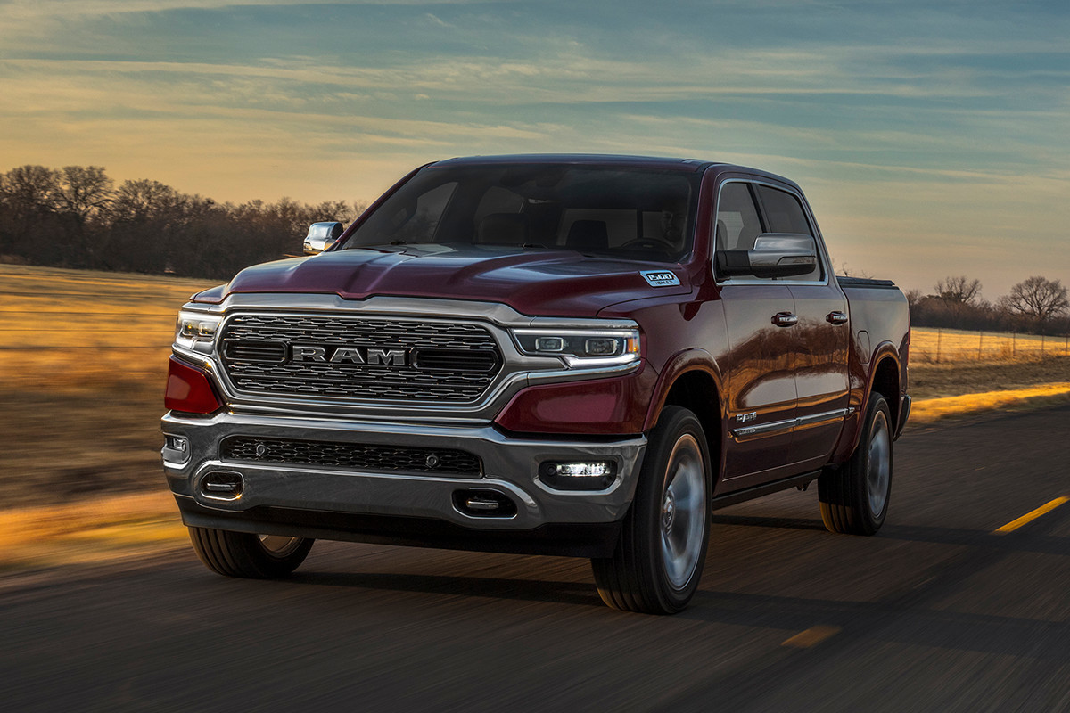 2019 Ram 2019 fuel efficient red driving on road with sunset