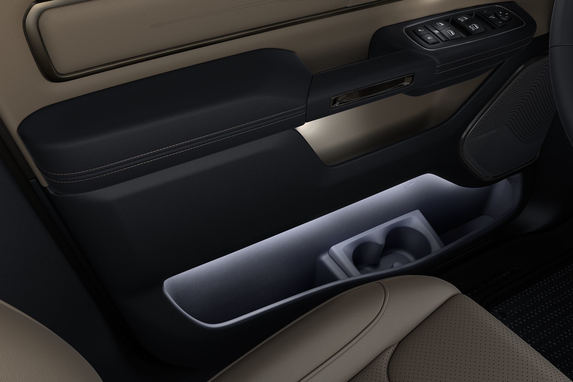 Driver's side door in the 2019 Ram 1500, highlighting illuminated open storage and cupholders