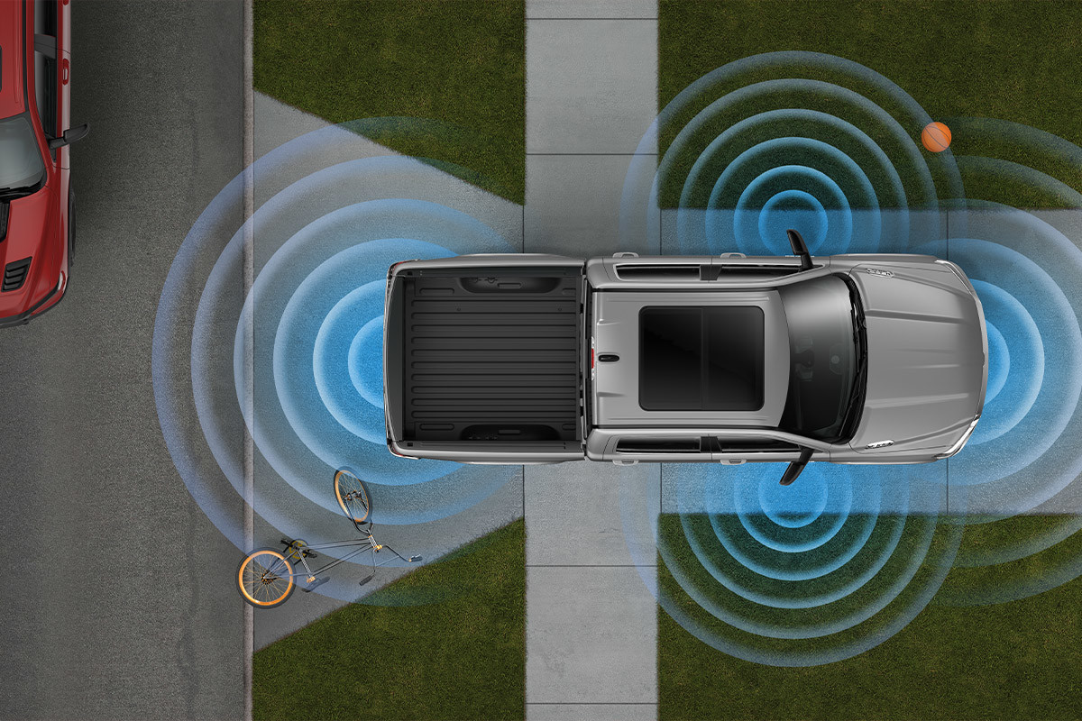 2022 Ram 1500 backing up with 360 degree sensors visually represented by the curved lines