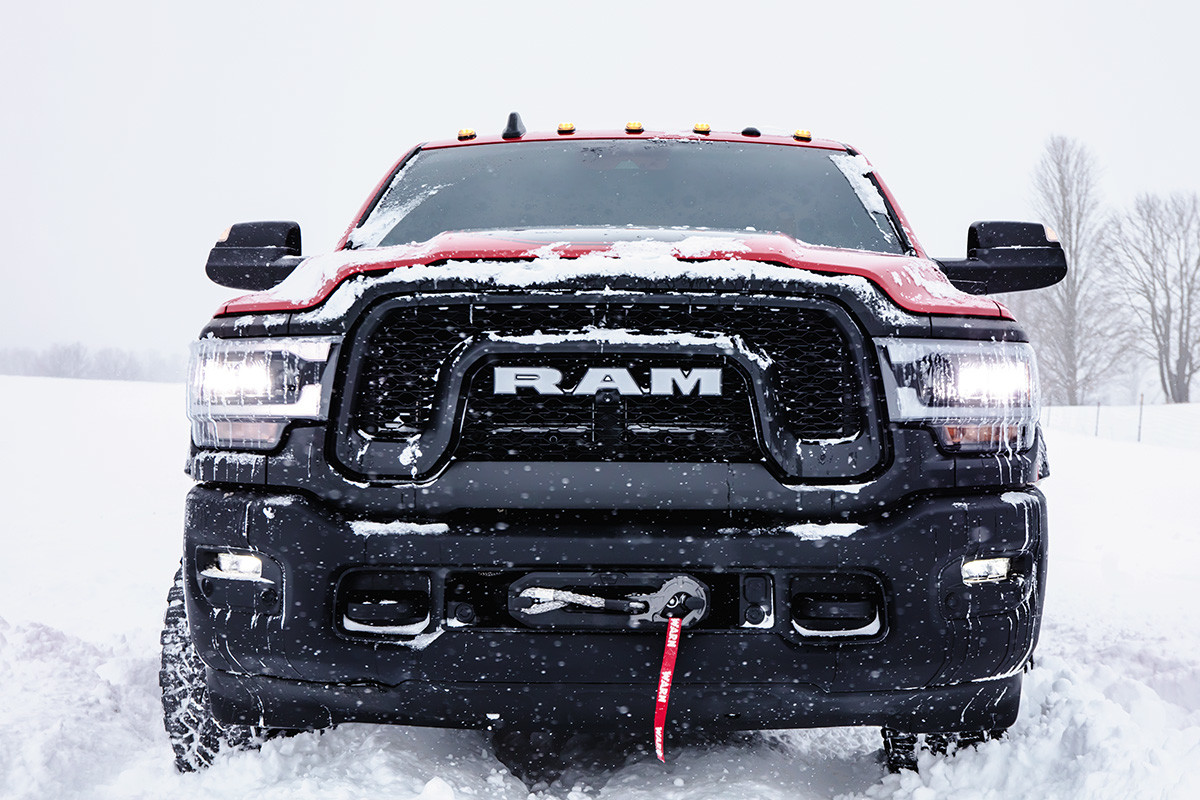 Front view of the red 2020 Ram 2500 Rebel parked in snow