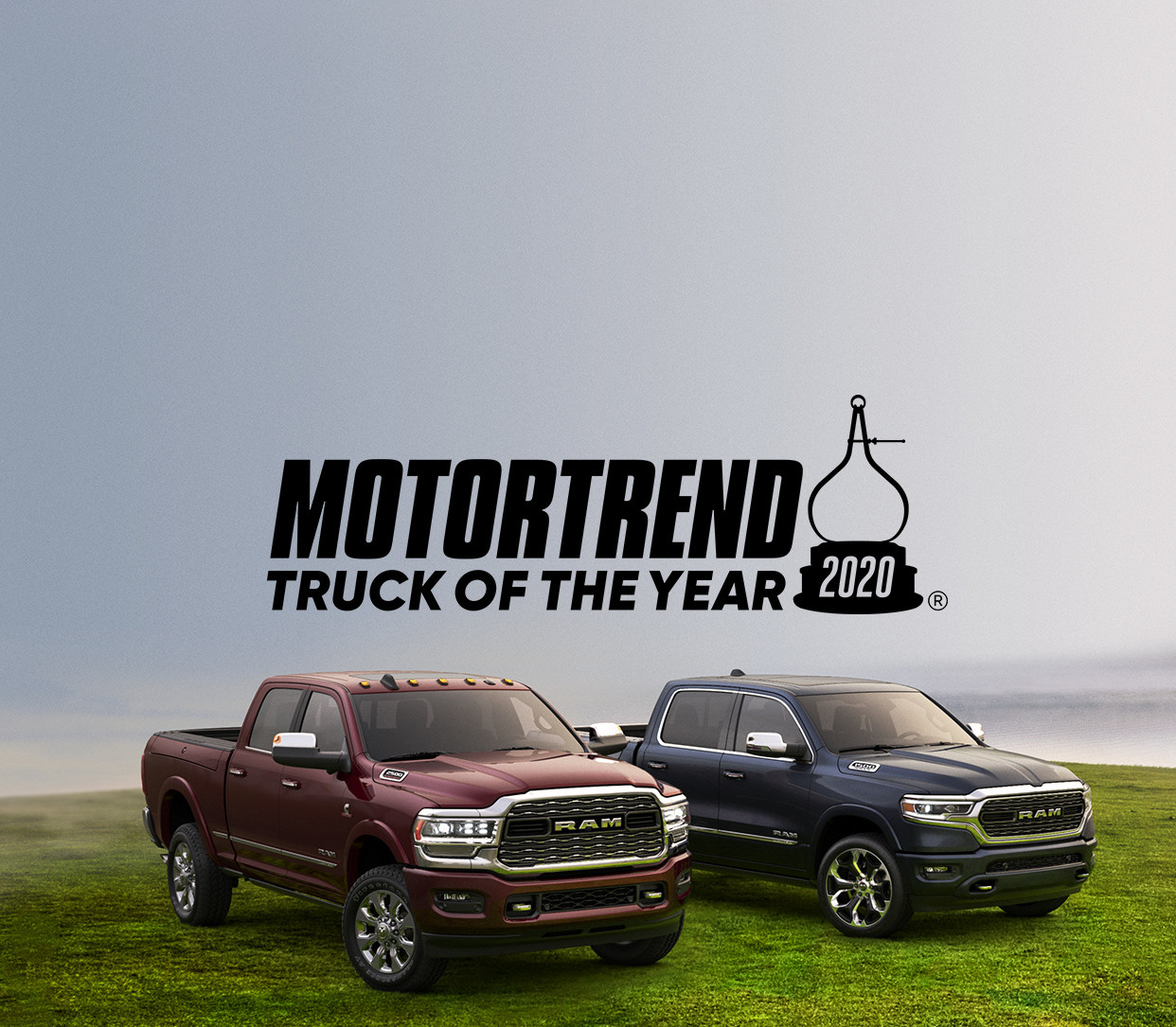 Front three quarter view of the New 2019 Ram 2500 and 1500 parked in green grass.