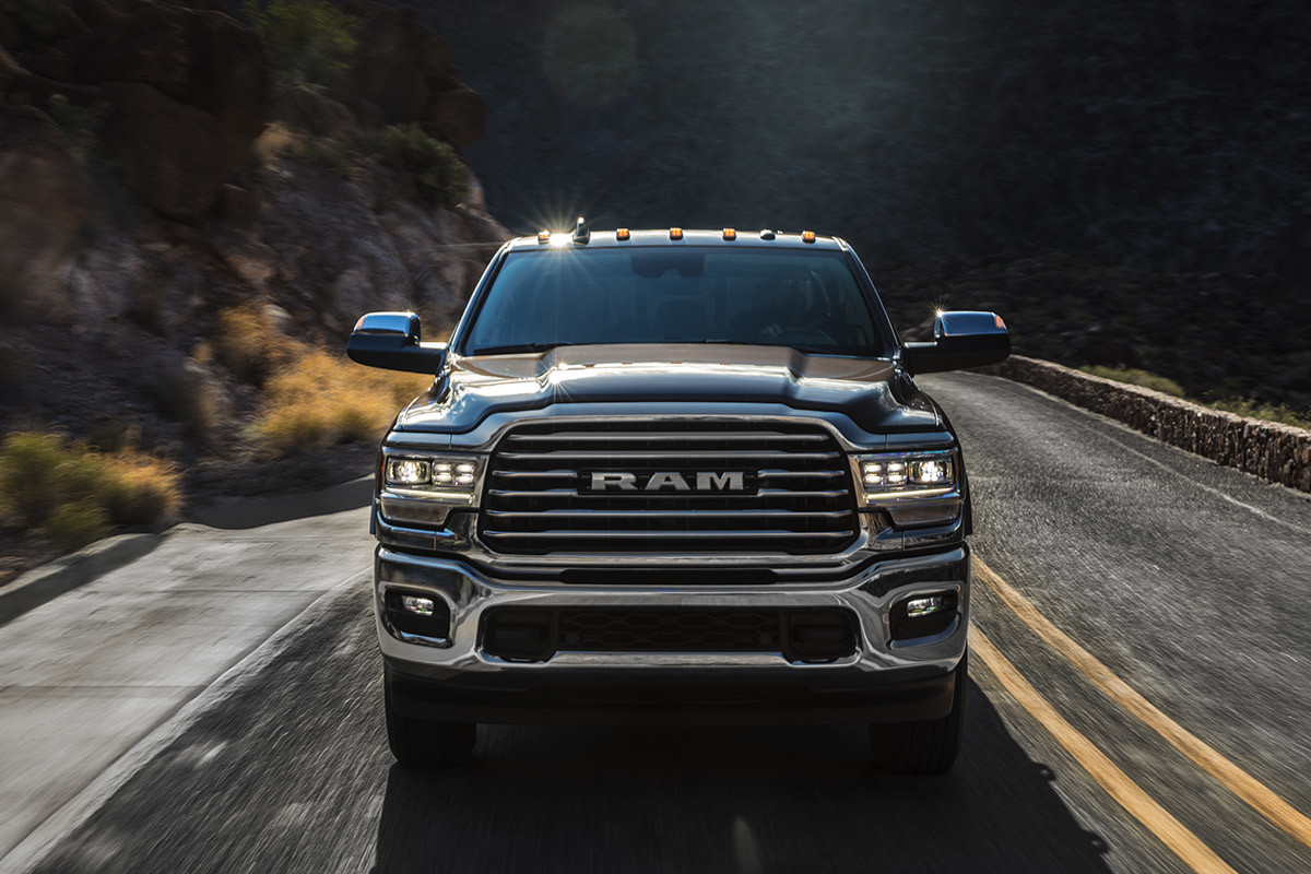 Front view of the 2020 Ram 2500 on a country road through mountains