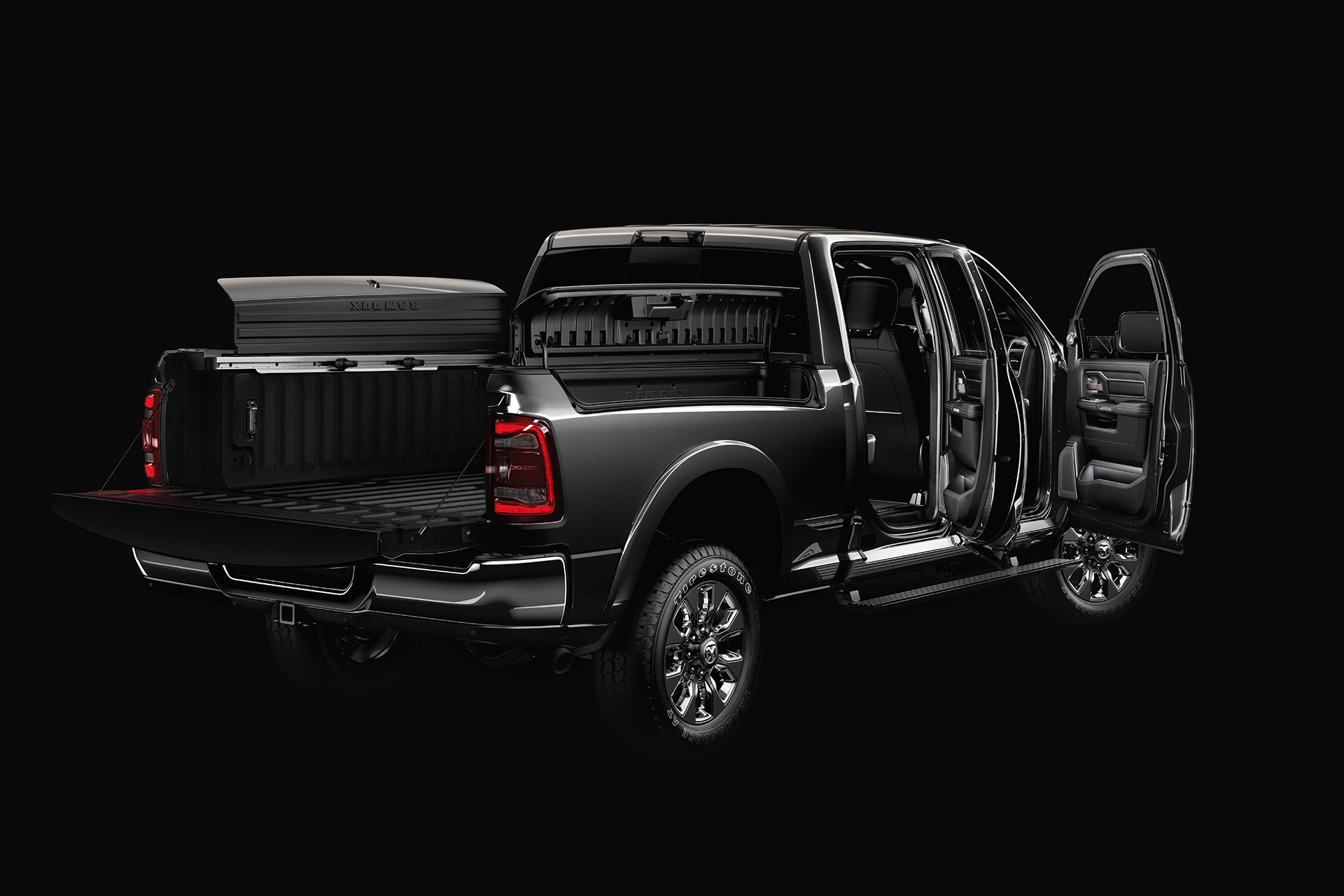 Rear three quarter view of the 2020 Ram 2500 with all door opened in a darkened studio