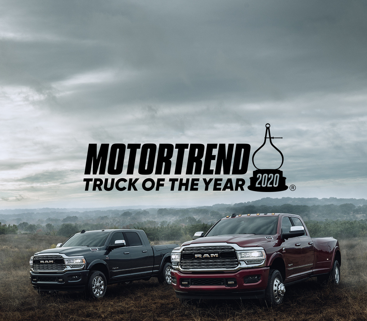 The 2020 Ram 2500 and 1500 parked on in the grass.