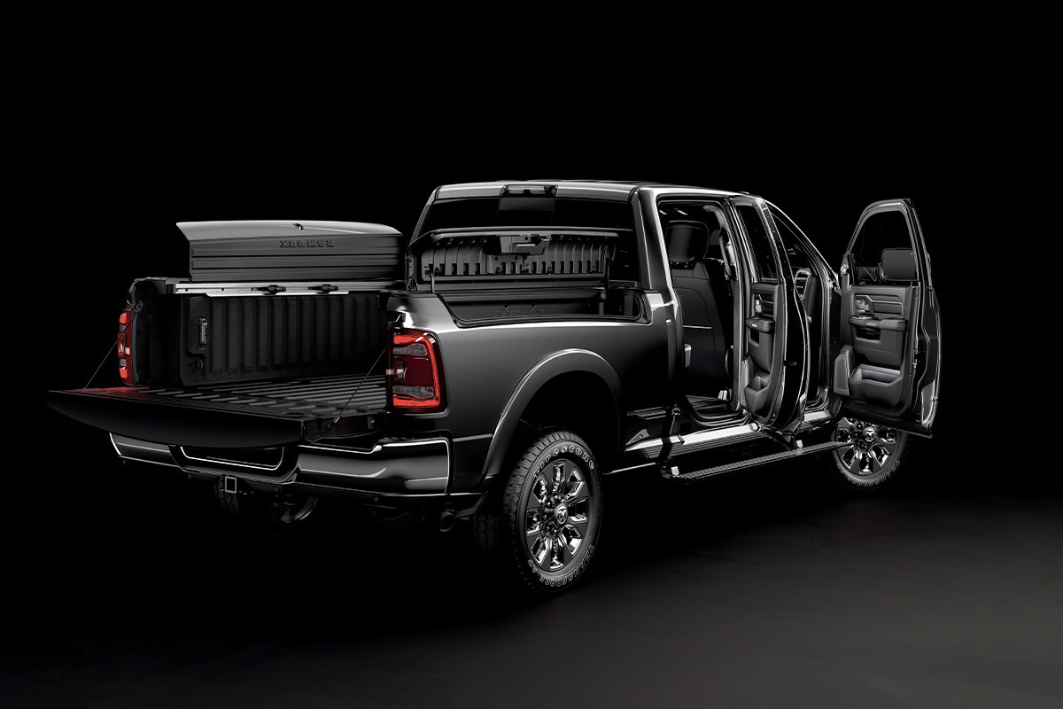 Back view of a 2022 Ram 2500, with all its doors, cargo box lid, and tailgate open.