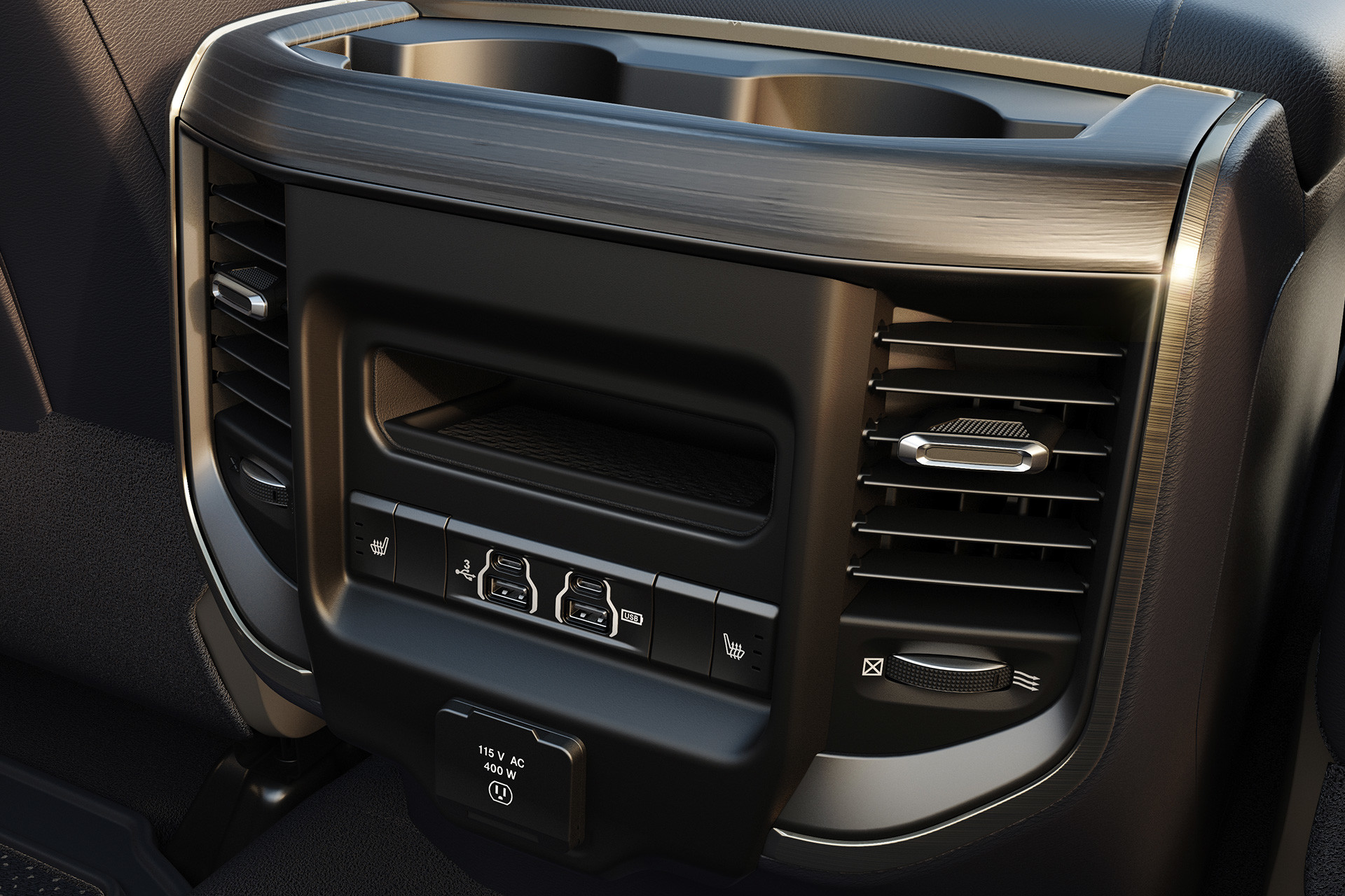 2019 Ram 3500 interior showing rear seat 115 volt outlet and USB ports.