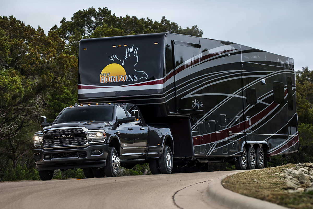 Black 2020 Ram 3500 hauling a very large trailer.