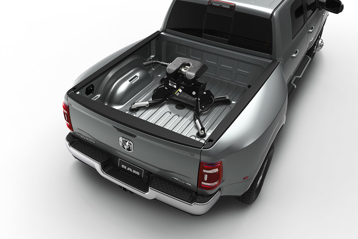 An overhead view of a Bright Silver Metallic coloured 2021 Ram 3500 equipped with a factory-installed gooseneck hitch from Mopar in the cargo bed.