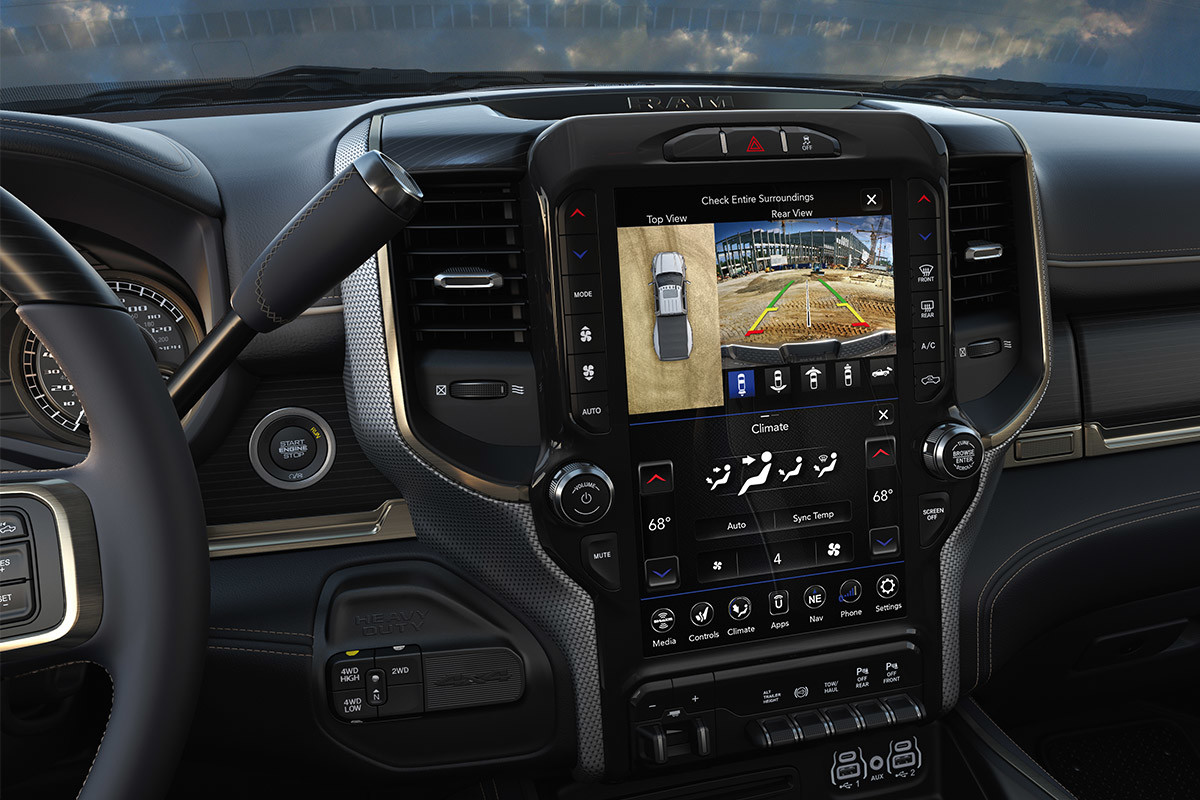 A close-up of the Uconnect touchscreen inside the 2021 Ram 3500 displaying an overhead view of the vehicle.