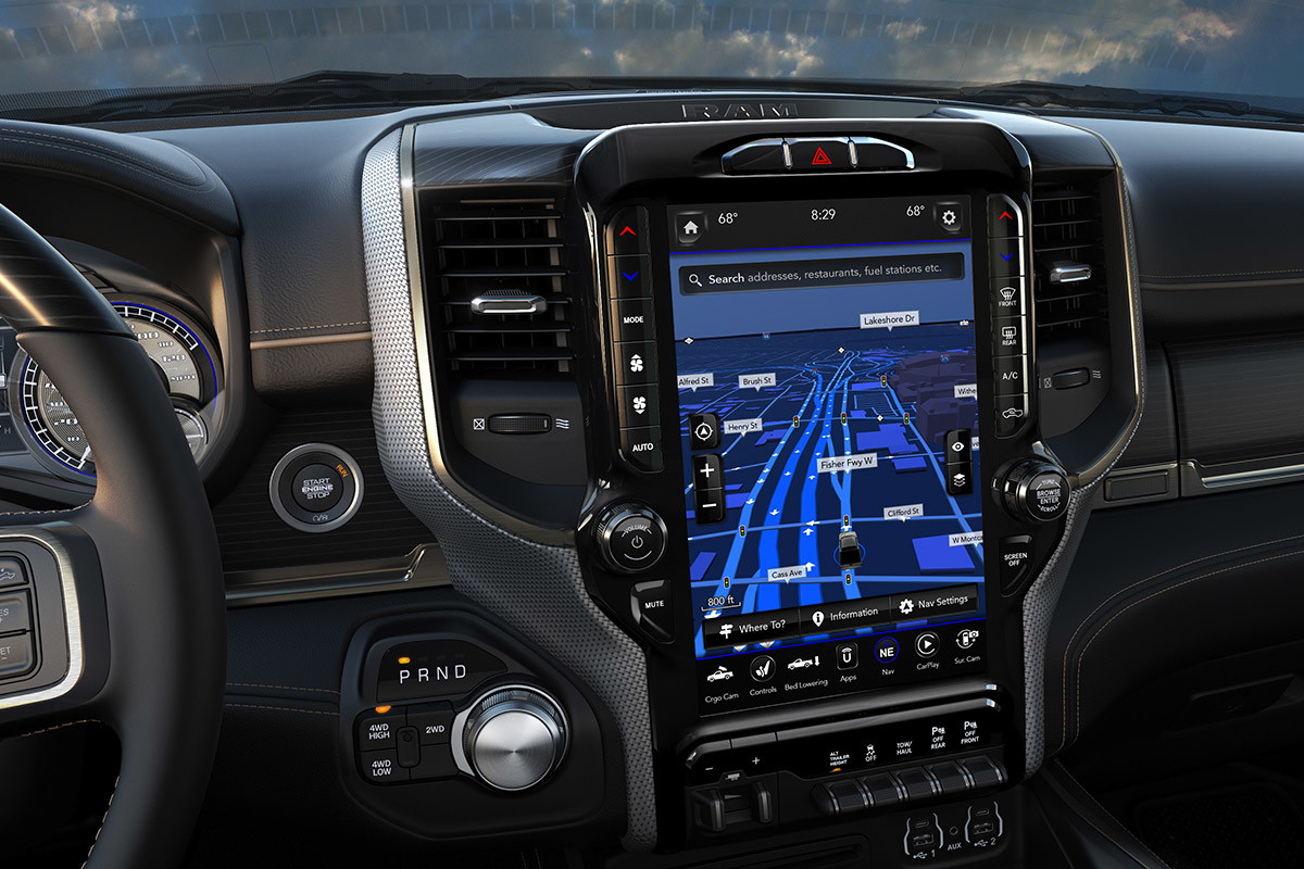 A close-up of the available Uconnect 12.0 multimedia centre displaying a 3-D City and Terrain map inside the 2021 Ram 3500.