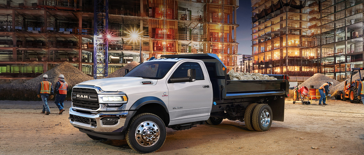 A new 2019 Ram Chassis Cab parked at a construction site.