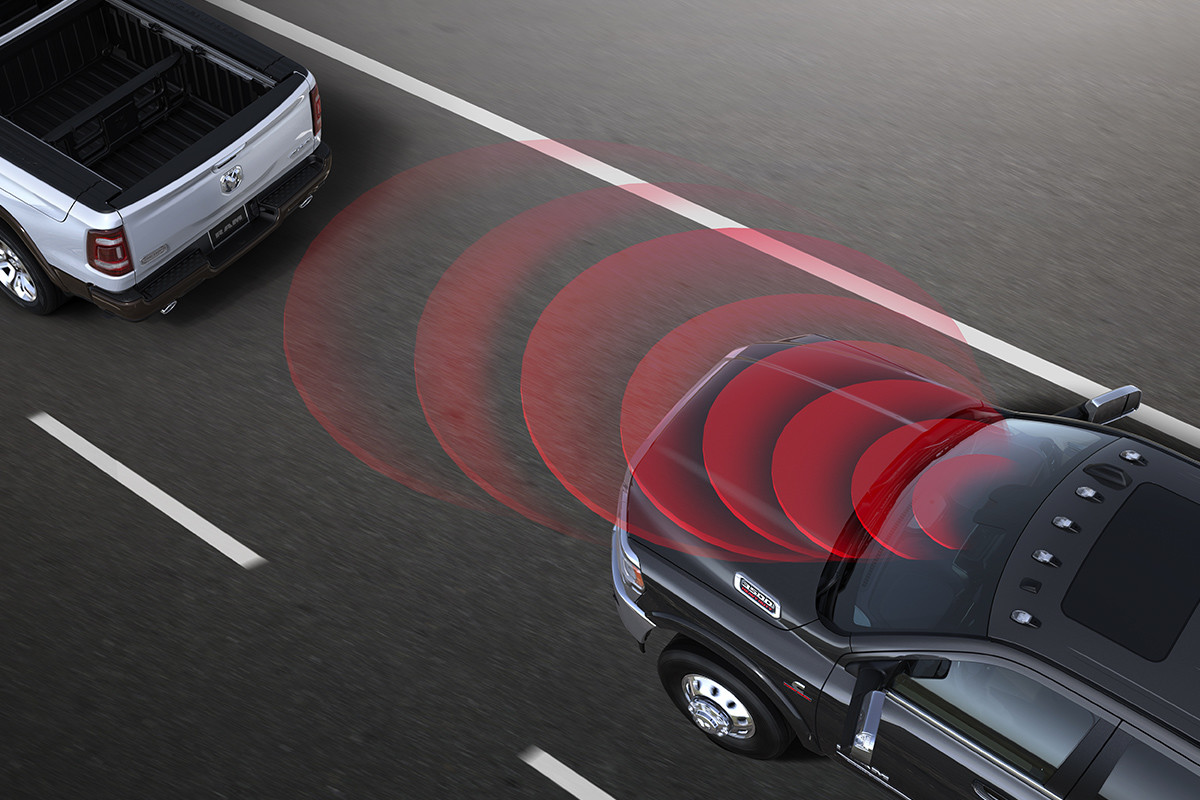 Birds Eye view of the 2020 Ram Chassis Cab driving on a road highlighting Advanced Collision Detection