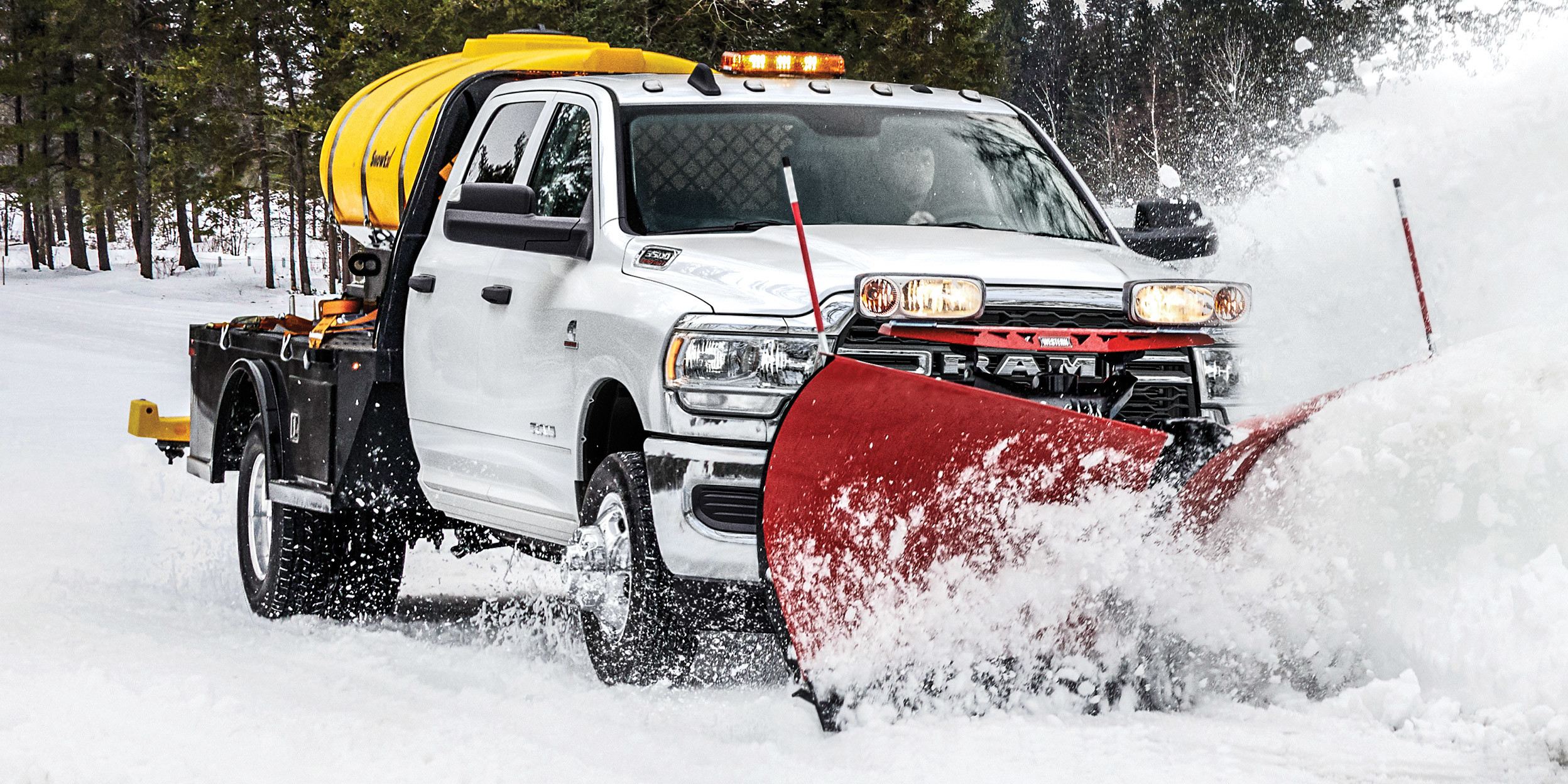 3500 SLT Chassis Cab Crew Cab DRW in Bright White with snow plow and anti-ice spray system.