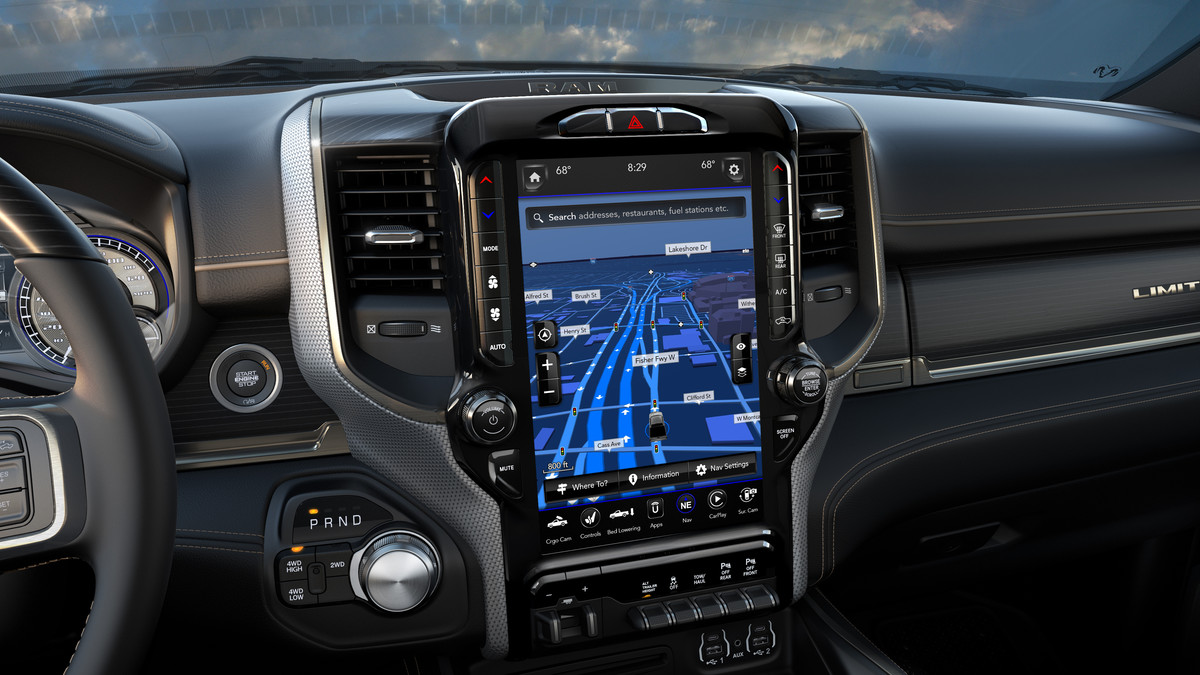 A close-up of the Uconnect multimedia centre touchscreen displaying a selection of the apps including SiriusXTraffic Plus inside a 2021 Ram Chassis Cab.