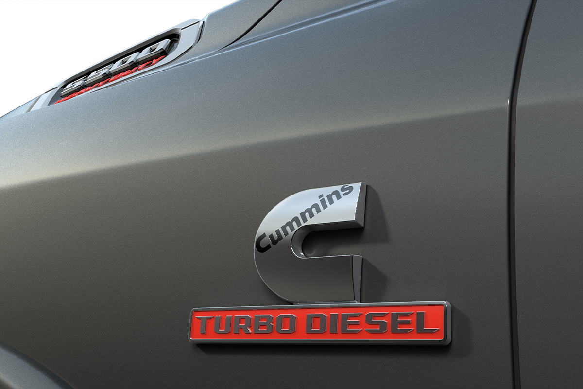 A Cummins Turbo Diesel badge on the side of a Granite Crystal Metallic 2022 Chassis Cab 5500.
