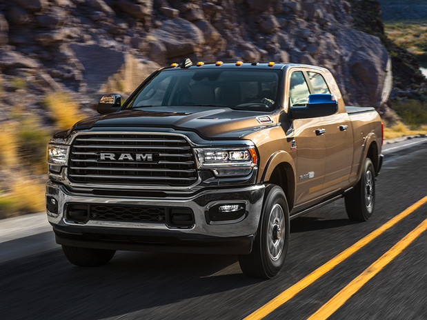 Black 2020 Ram 1500 being driven fast on the road