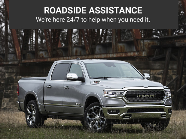 Roadside Assistance. We’re here 24/7 to help when you need it. Silver Ram 1500, parked outdoors.